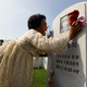 A North Korean woman mourns her father, who died in the war.